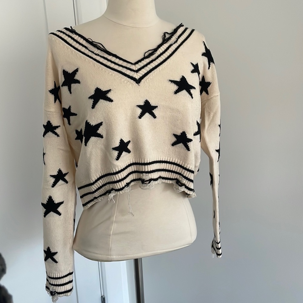 Chelsea ivory and black star sweater distressed